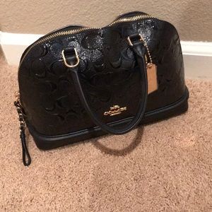 Black and gold coach purse.